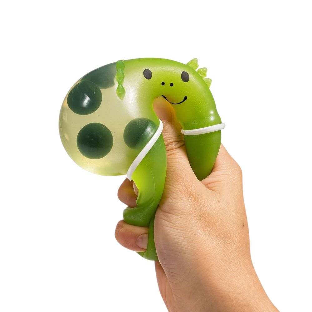 Hand squishing a green axolotl boba tea squish toy showing how stretchy it is