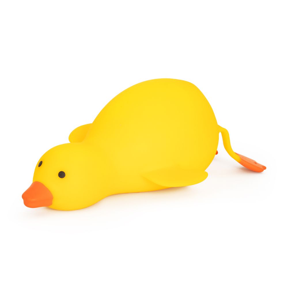 Bright yellow Big Squij Duck squishy toy standing alone with an orange beak and tail