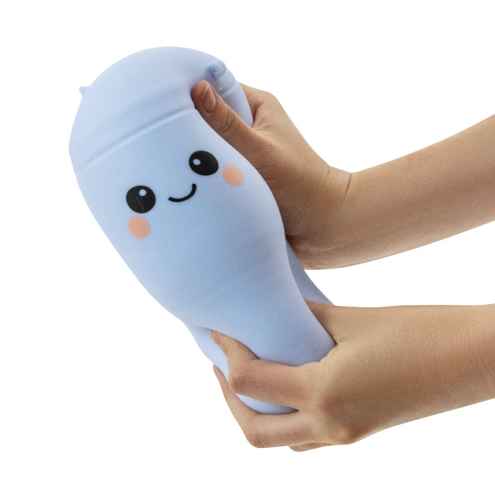 Hands squeezing the soft blue Big Squij Tumbler squishy toy to show its texture