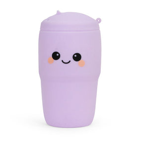 Pastel lilac Big Squij Tumbler squishy toy with a smiling face, standing alone
