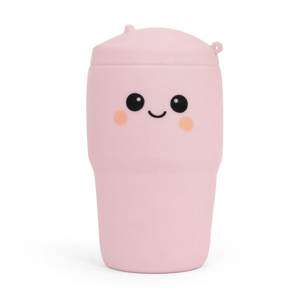 Pastel pink Big Squij Tumbler squishy toy with a smiling face, standing alone
