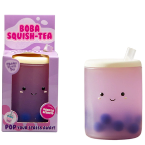 Kawaii vanilla scented boba tea squishy stress toy next to its purple Boba Squish-Tea gift box