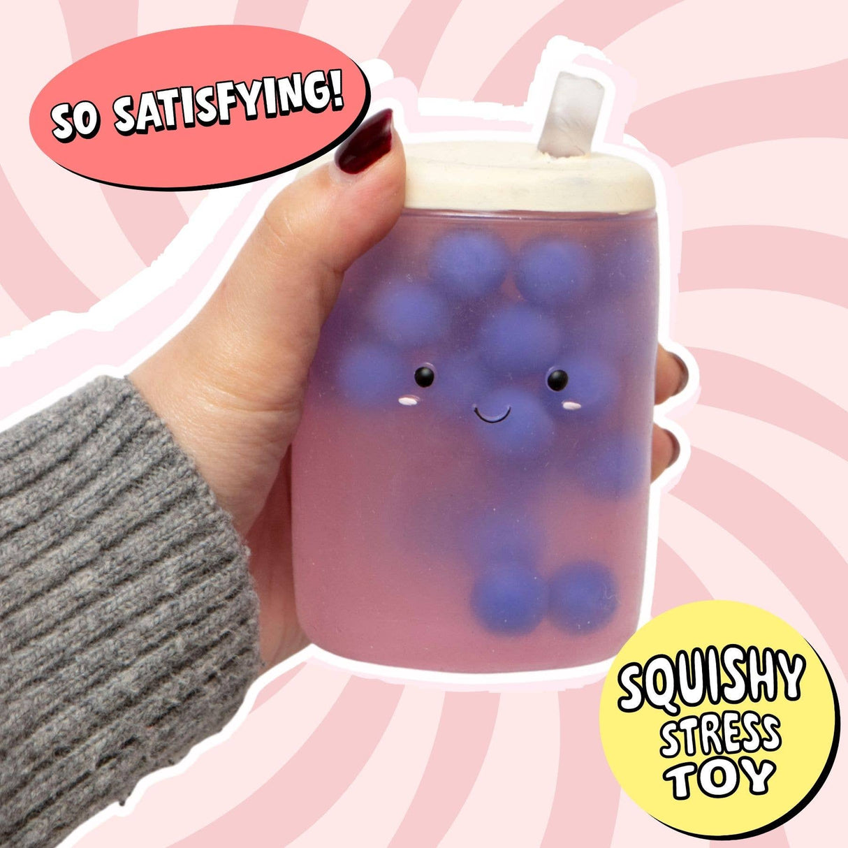 Hand holding the Boba Squish-Tea squishy showing full cup shape with tapioca bubbles and straw