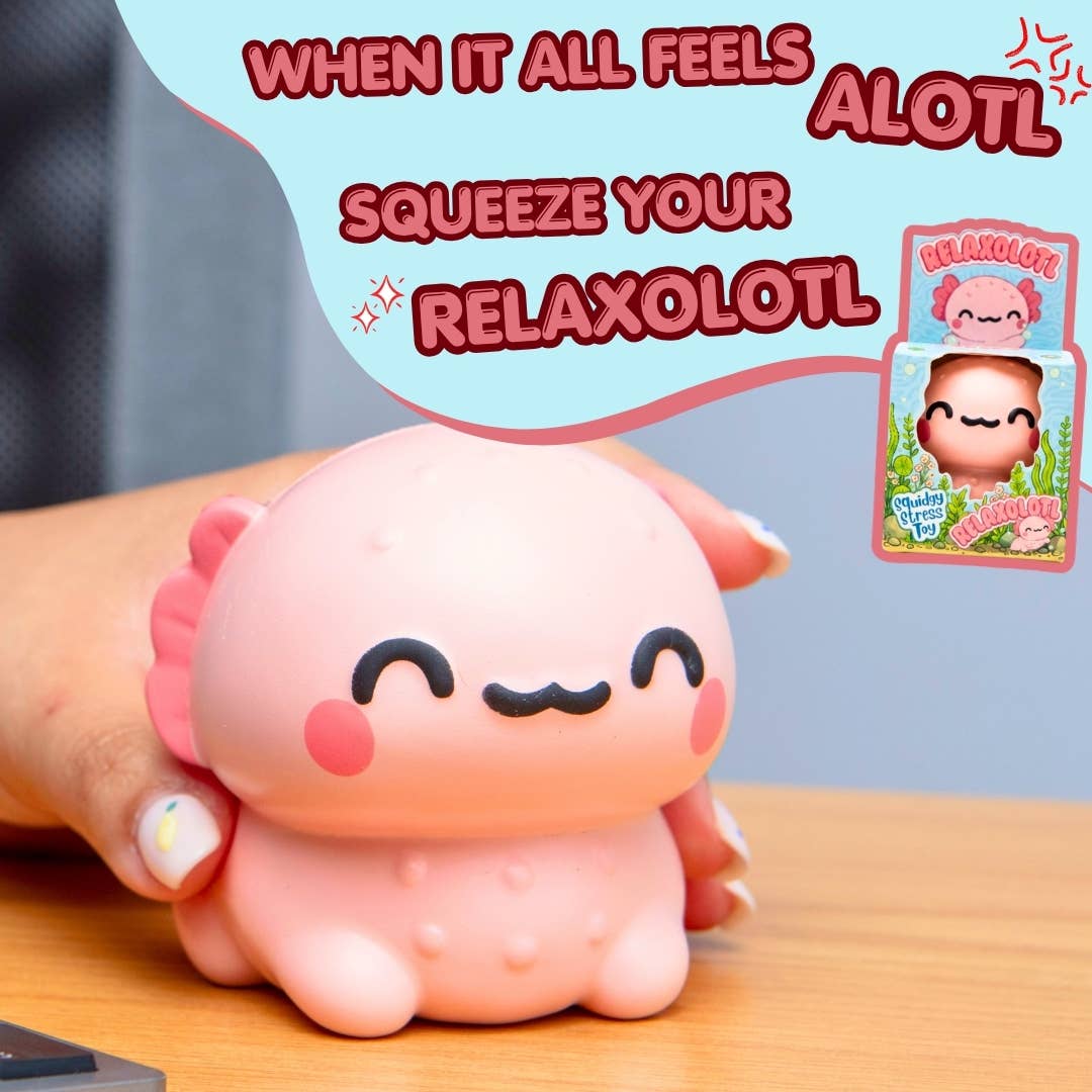 A pink cartoonish squishy toy being held by a hand on a wooden surface, with a light blue speech bubble containing the text 'WHEN IT ALL FEELS ALOOT SQUEEZE YOUR RELAXOLOT' and a small product package shown at the upper right.