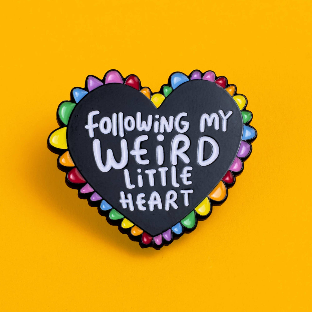 Katie Abey Following My Weird Little Heart black rainbow soft enamel pin, yellow background
