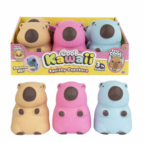 Three squishy capabara toys in yellow, pink, and blue packaging with 'Cool Kawaii' branding.