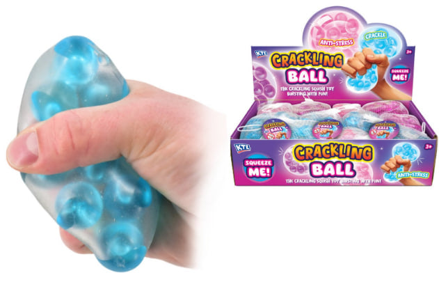 Hand squeezing blue Crackling Bead Ball ASMR anti-stress squishy sensory fidget toy alongside pink and blue display box