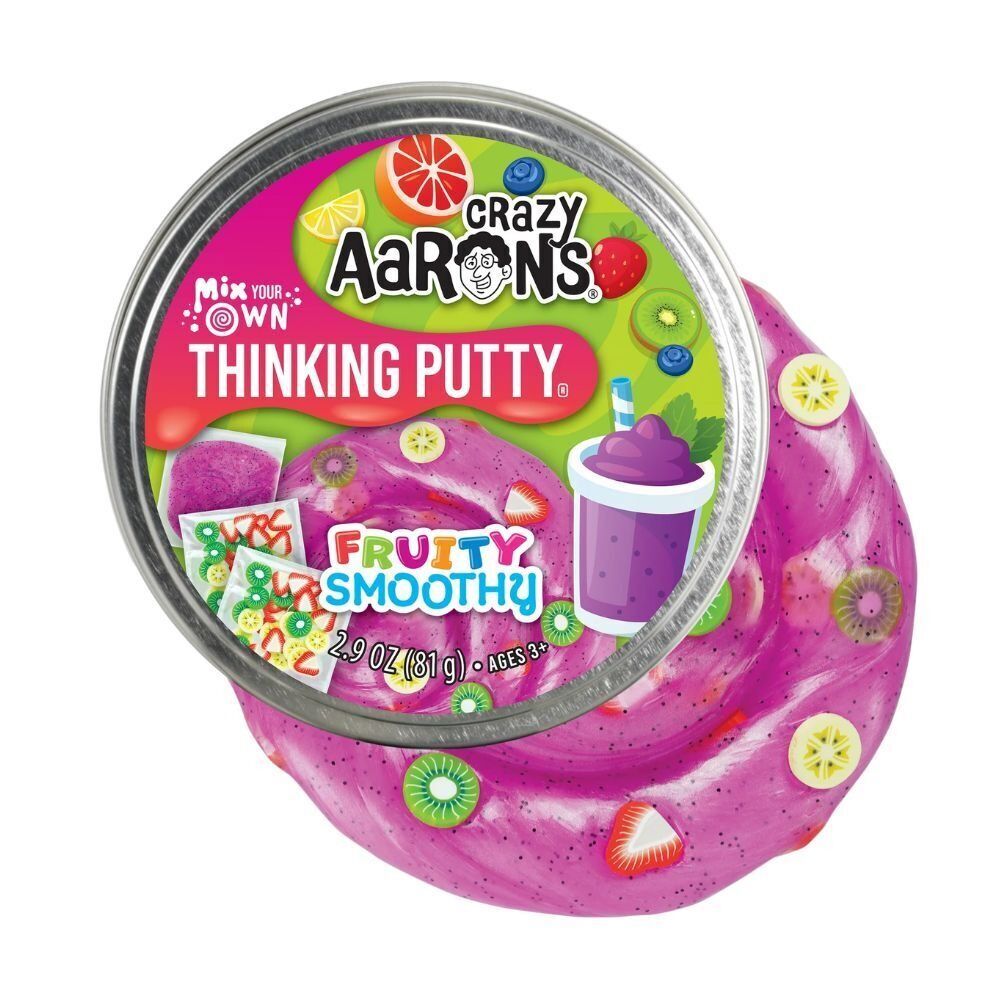 Crazy Aaron's Fruity Smoothy Thinking Putty spilling out of its tin with fruit charms mixed in