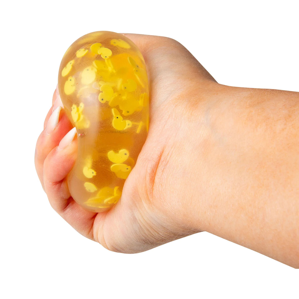 Hand squeezing a clear yellow duck squish ball showing it bulging with duck clay slices visible inside