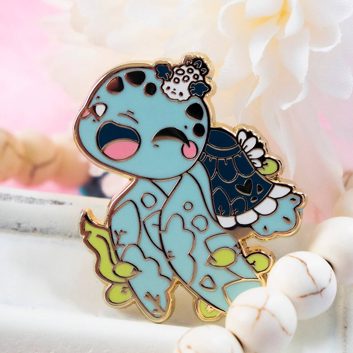 Evy Benita Leatherback Sea Turtle enamel pin close-up with pink flowers, gold plating