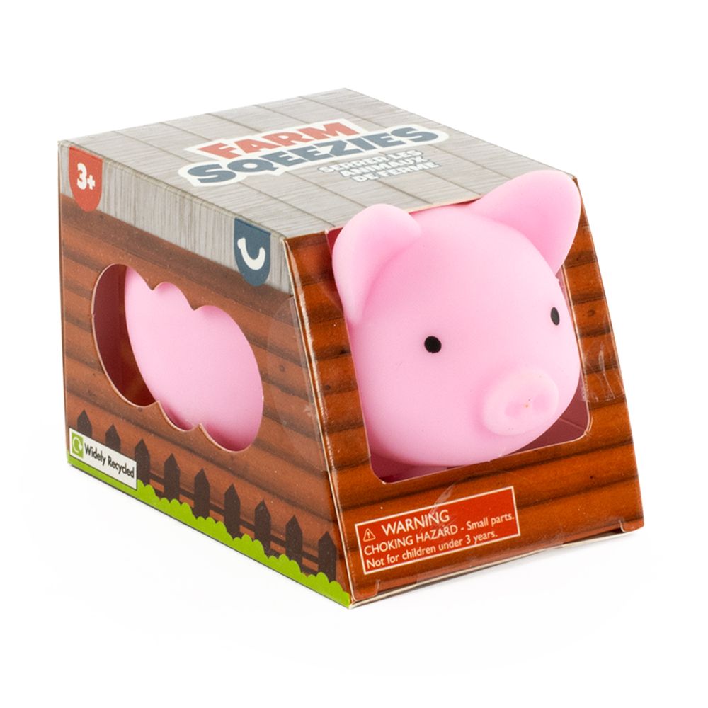 Farm Squeezies pink pig squishy sensory toy in barn-themed box packaging, ages 3 plus