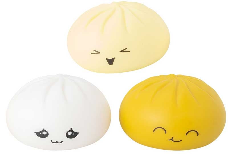 All three Giggletastic Mystery Bao Buddy kawaii squishy characters in cream white and golden yellow with cute expressions