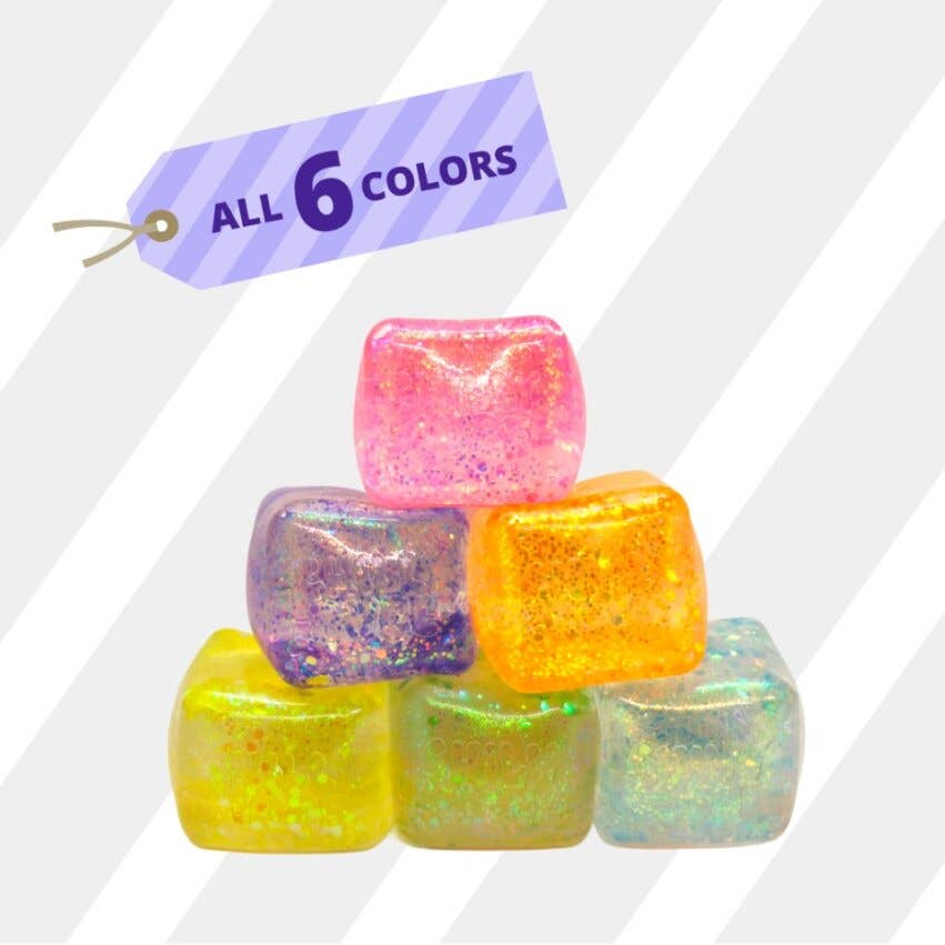 Colorful glittery cubes with a tag indicating 'All 6 Colors' on a white background