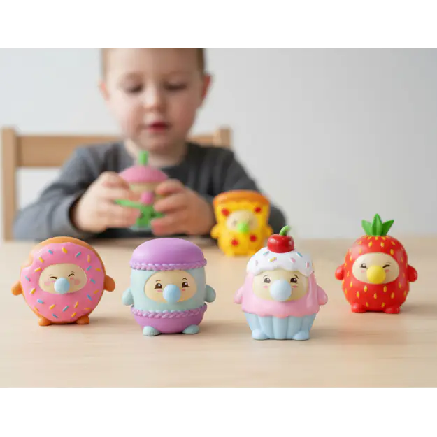 Donut, macaron, cupcake and strawberry Gum Gums squeeze toy figures lined up on table