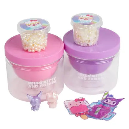 Hello Kitty and Friends slime jars with pearl mix-ins beside collectible charm figures and stickers