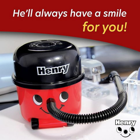 Henry Hoover mini desk vacuum red black novelty toy, lifestyle shot