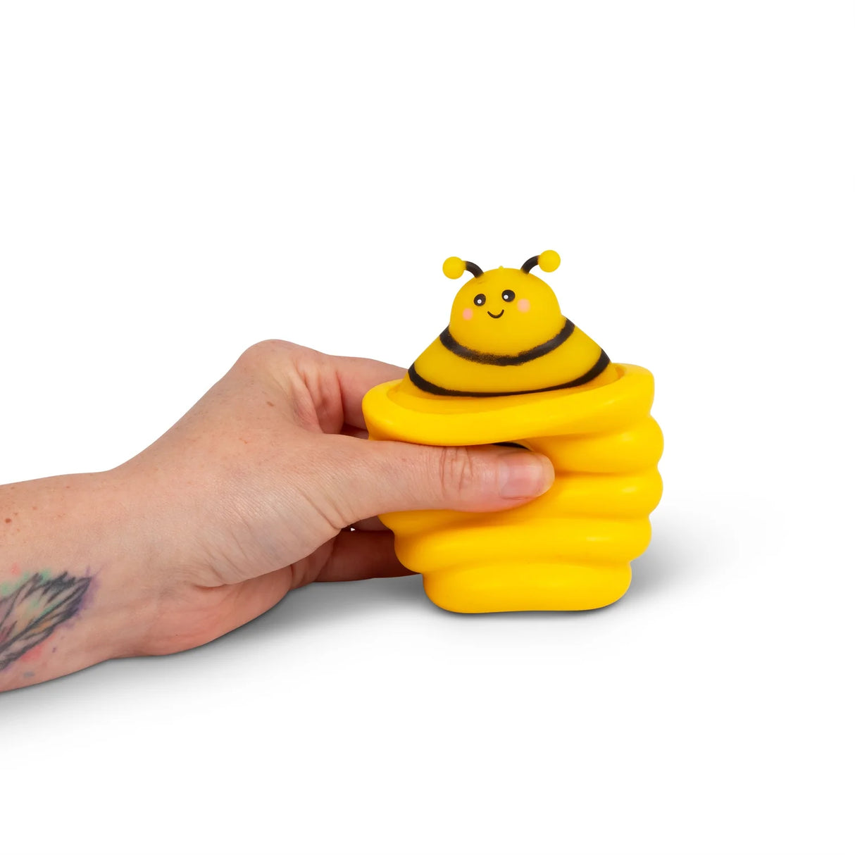 Yellow HGL Pop Up Beehive squeezed with bee sensory fidget toy