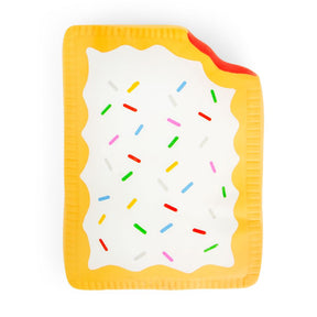 Flat lay of a jumbo golden yellow squishy Pop-Tart with white icing drizzle and colourful sprinkles