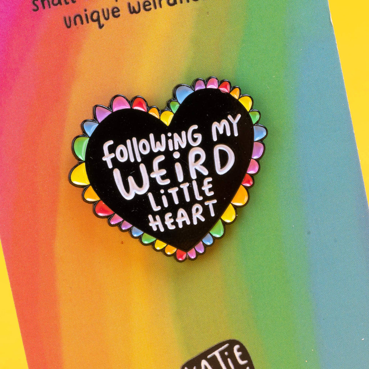 Katie Abey Following My Weird Little Heart soft enamel pin close-up on rainbow backing card