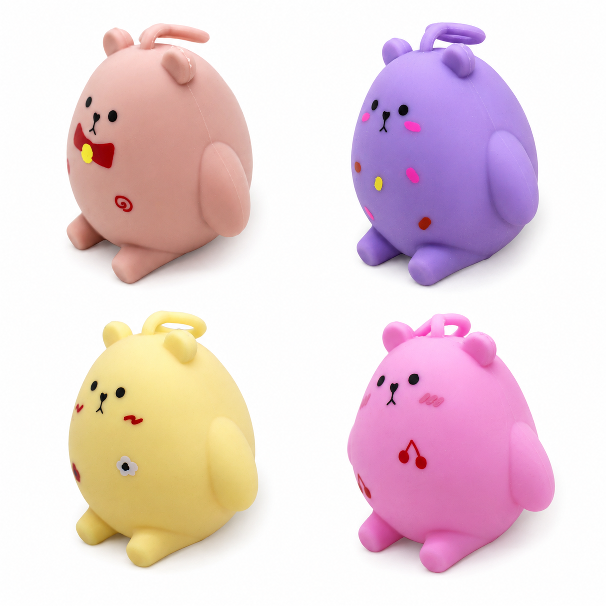 Four kawaii bear squishy toys — pink, purple, yellow, hot pink pastel set