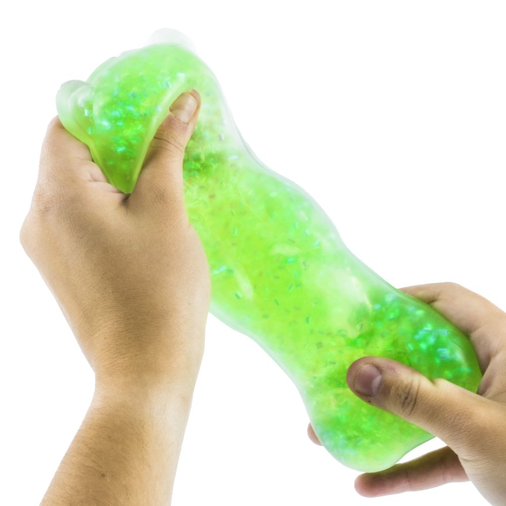 Hands stretching green Keycraft Squishy Bear glitter gummy bear squishy with sparkly flakes