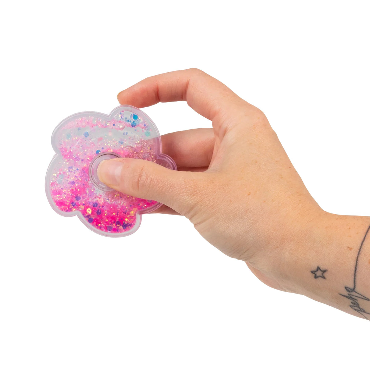 Pink liquid glitter flower fidget spinner held in hand, sensory toy