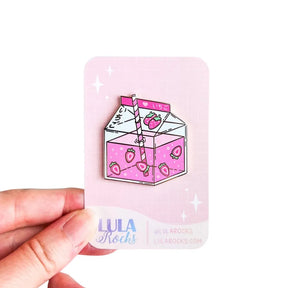 Lula Rocks Strawberry Milk kawaii enamel pin on backing card, white background