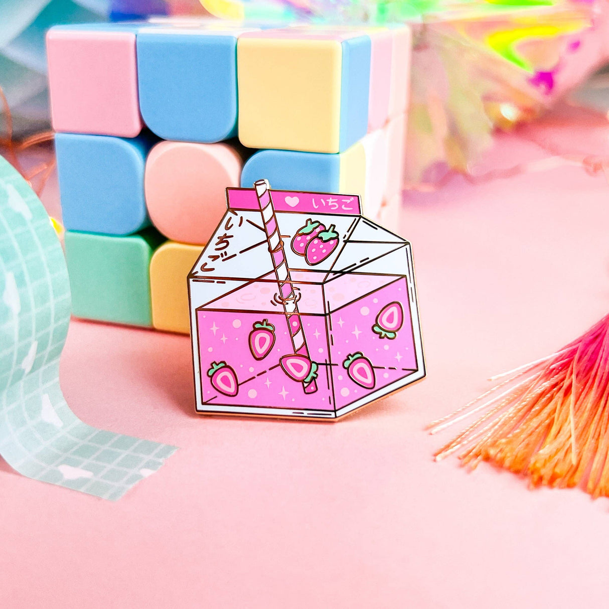 Lula Rocks Strawberry Milk enamel pin, pink colorway, pastel blocks lifestyle shot