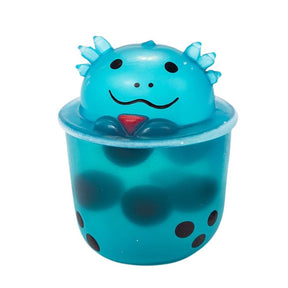 Blue axolotl boba tea squish toy with spiky head and bubble tea cup body