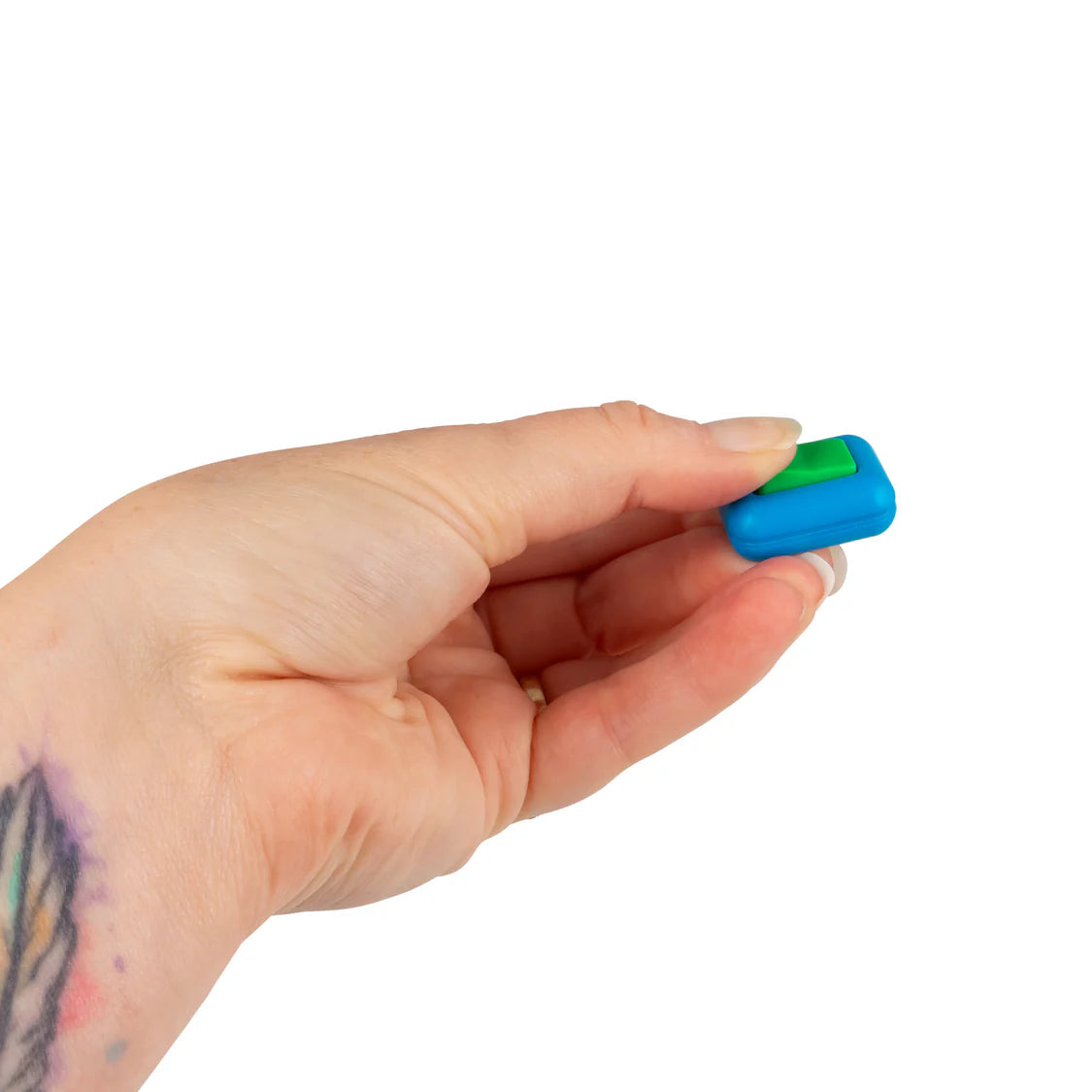 Adult hand pinching a small blue and green clicker fidget