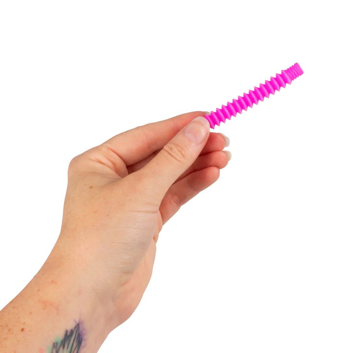 Adult hand holding a pink micro pop tube fidget toy