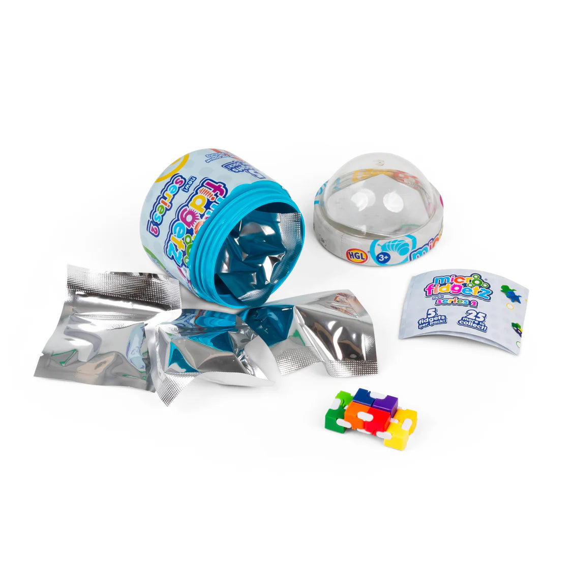 Opened Micro Fidgetz Series 2 tub showing capsule base, dome lid, silver blind bags and a rainbow infinity cube