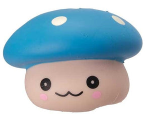 Close-up of blue kawaii squishy mushroom fidget toy with white spots and smiling face