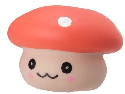 Close-up of orange kawaii squishy mushroom fidget toy with white spot and smiling face