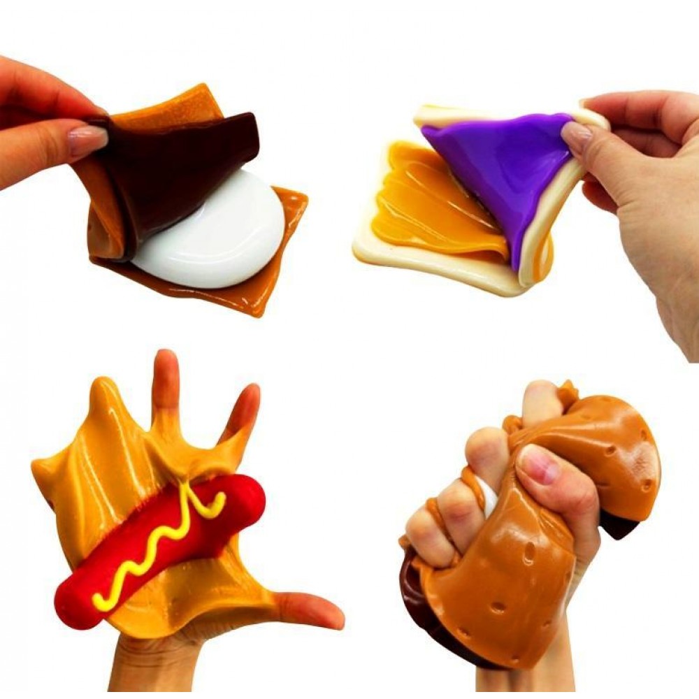 Hands peeling apart and stretching layered Mushmeez taba squishies showing s'more and sandwich designs