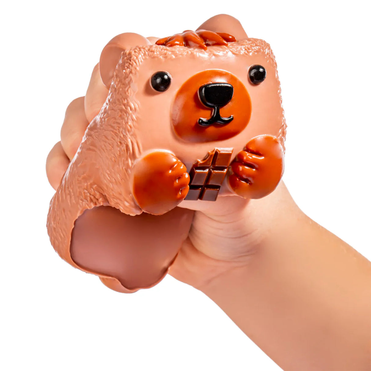 Hand squeezing MushyKinz Button the Bear taba squishy, soft sensory fidget toy