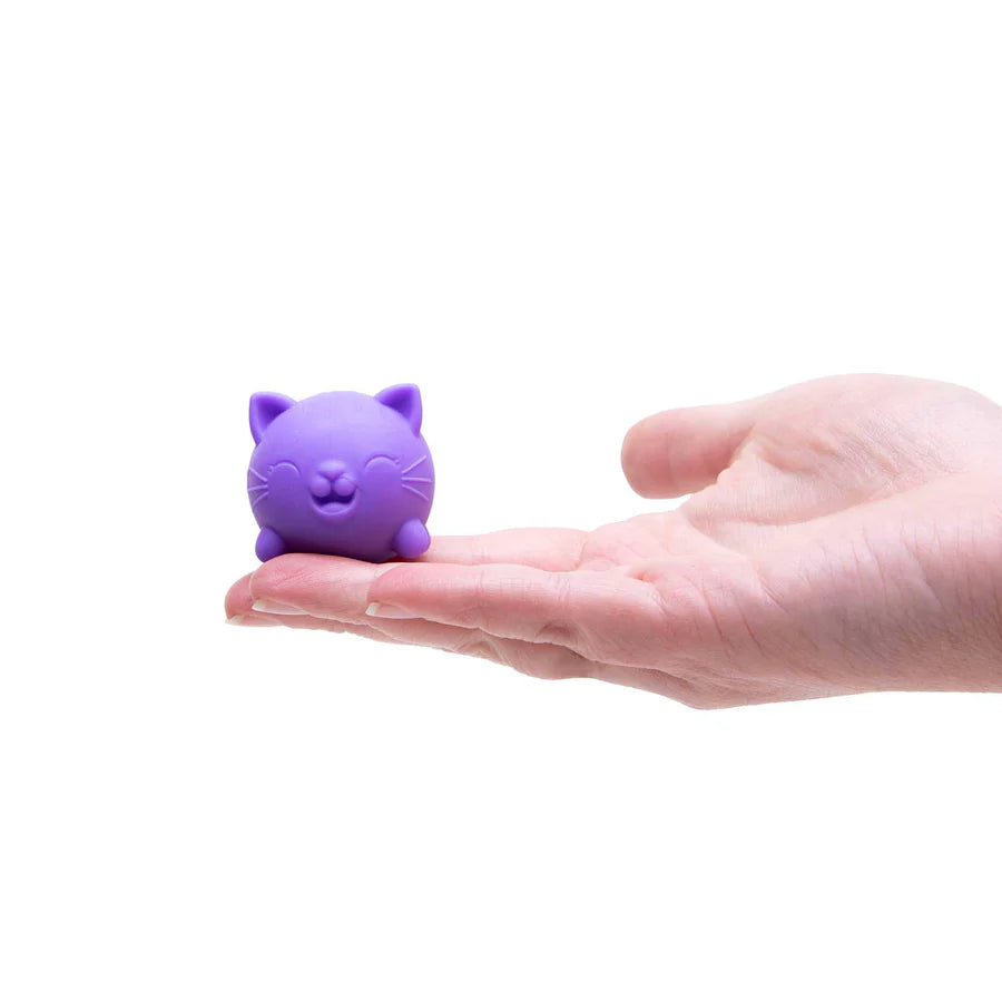 Purple Jinxy Nee Doh Cool Cat squishy resting in an open palm to show size