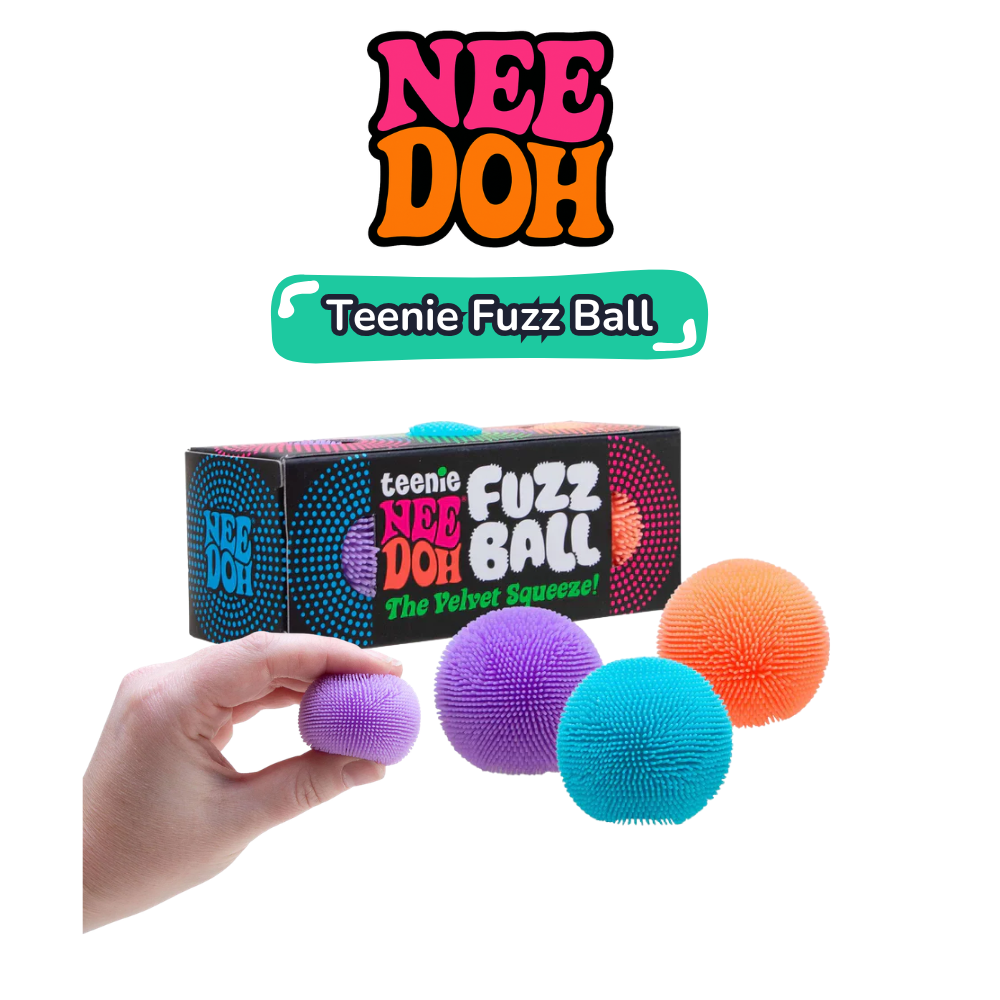 Hand holding purple fuzz ball alongside teal and orange fuzz balls in front of Teenie Fuzz Ball gift box