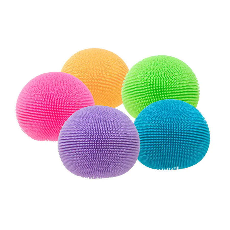 Five NeeDoh Fuzz Ball sensory stress toys in pink, orange, green, purple and blue on white background
