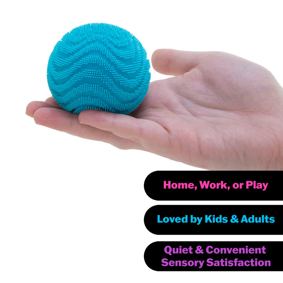 Blue NeeDoh Fuzz Ball Wonder Waves sensory ball resting on an open palm showing size and texture
