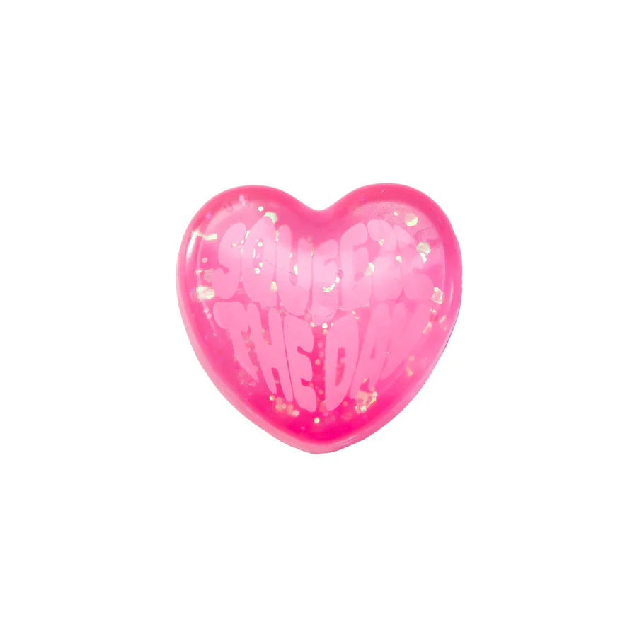 Pink glitter Nee Doh Good Vibes Only squish heart with Squeeze the Day embossed message on white background