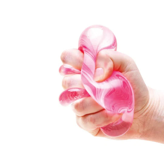 Nee Doh Nice Cube Candy Swirl pink squishy stress relief fidget toy squeezed in hand