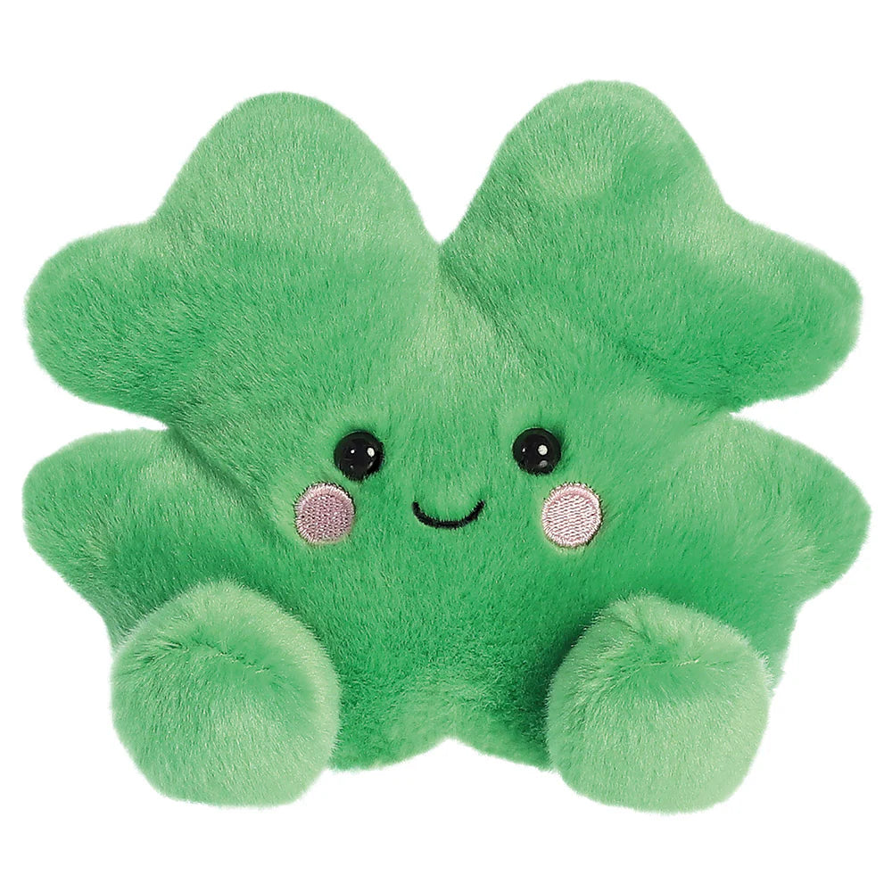 Aurora Palm Pals Chance Clover plush β a bright green four-leaf clover soft toy with a cheerful smiling face, pink embroidered cheeks, and rounded paw-like feet