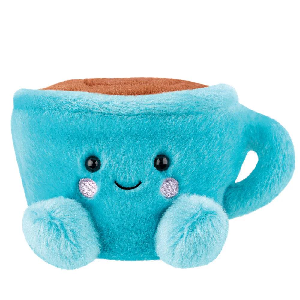 Aurora Palm Pals Essie Coffee Cup plush β a teal blue mug-shaped soft toy with a brown coffee-coloured interior, lavender blush cheeks, a smiling face, and rounded paw feet