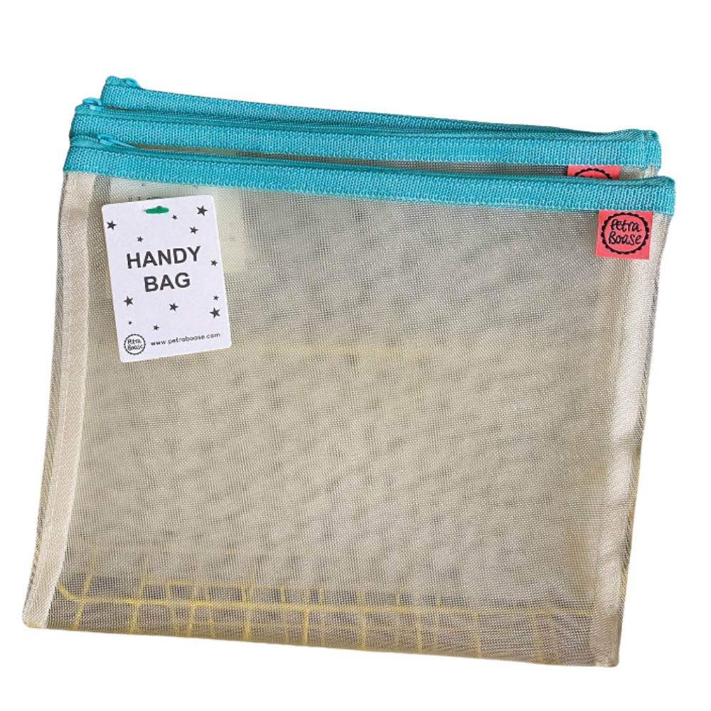 Petra Boase pale mesh handy bag with teal zip shown flat against white background with Handy Bag tag