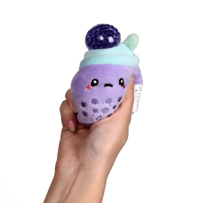 Purple Queasy Squeezies bubble tea plush — dark bead stress ball pops out on squeeze