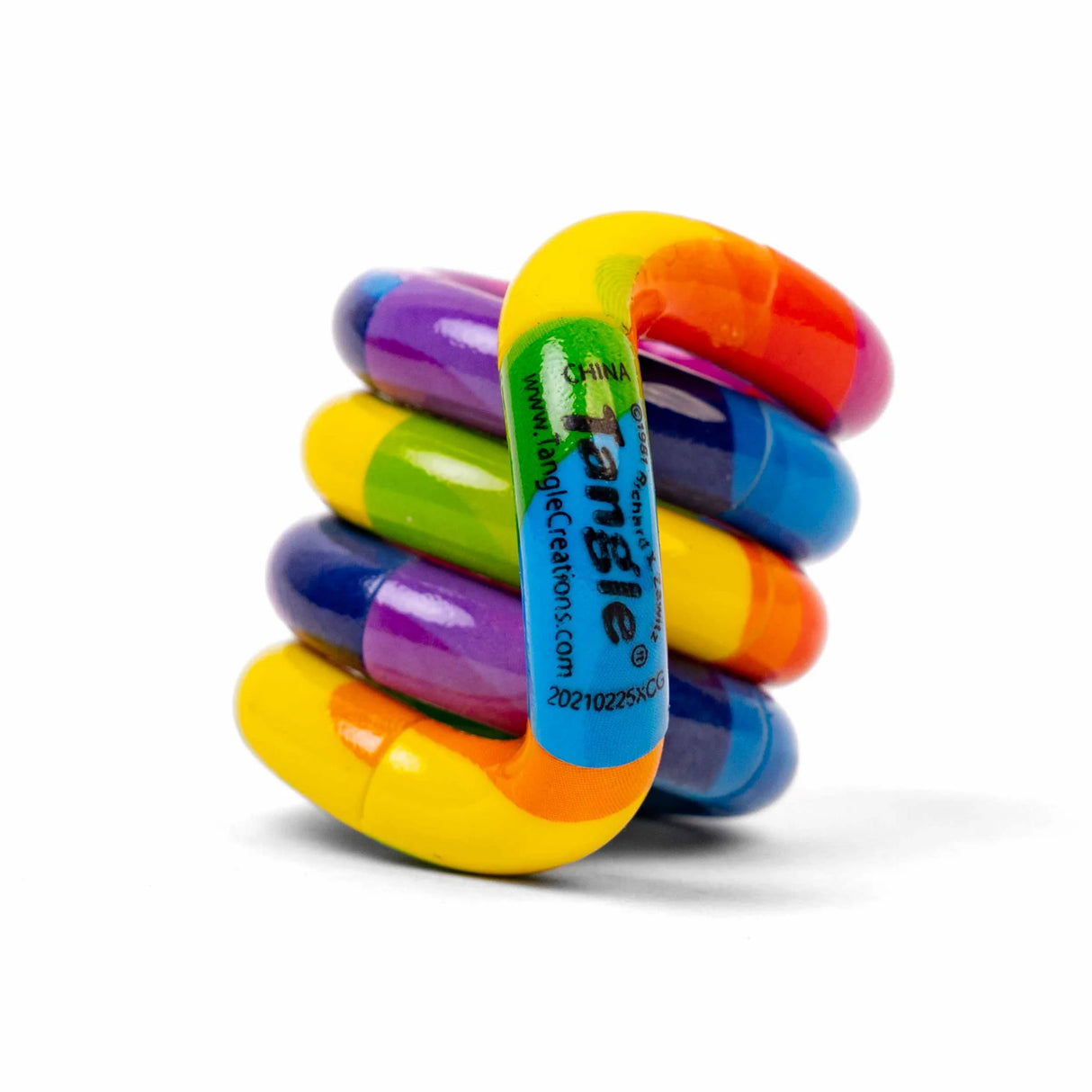 Colorful Tangle toy stacked on a white background