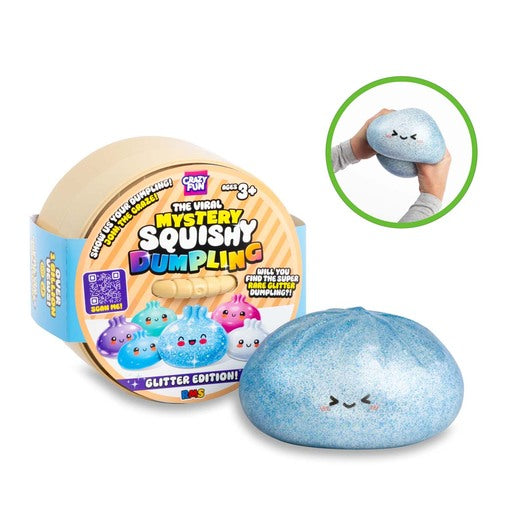 A blue glittery squishy dumpling toy shown next to its circular packaging container, with a small inset image in the top right showing a hand squeezing the toy.