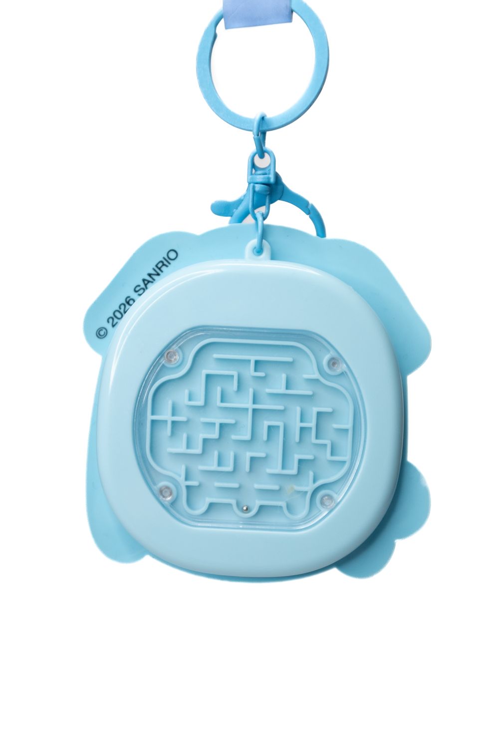 Back of Sanrio Cinnamoroll fidget keychain showing blue ball maze puzzle game