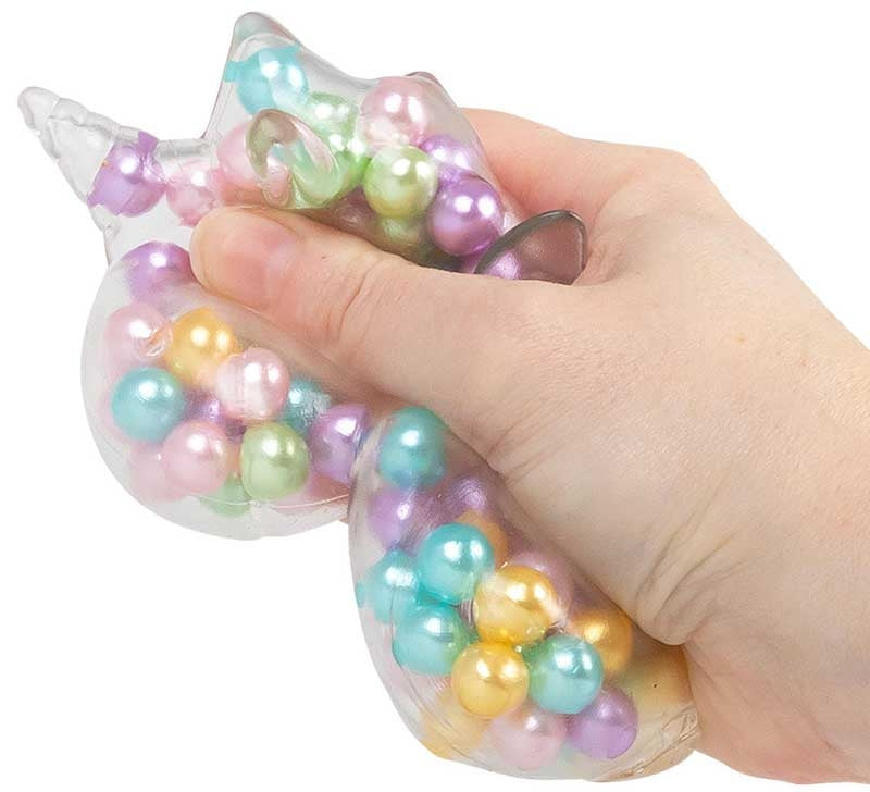 Hand squeezing Scrunchems ASMR Rainbow Unicorn showing pearlescent rainbow beads shifting inside clear squishy.